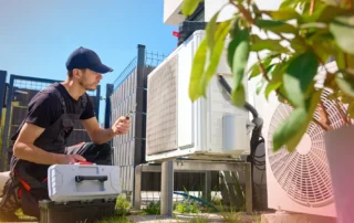 HVAC Technician Performing Emergency Repair On A Residential Heating And Cooling System To Restore Reliable Indoor Comfort And System Performance.