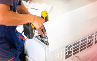HVAC Technician Performing Emergency Repairs On A Heating And Cooling System To Restore Safe And Reliable Indoor Comfort.