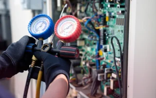 HVAC repair technician diagnosing a system in Warwick, RI home